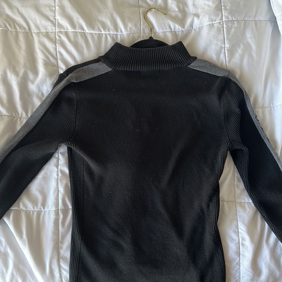 It is brand new small,neck zip up, sweater by Tommy Hilfiger.The color is black. - Picture 2 of 5